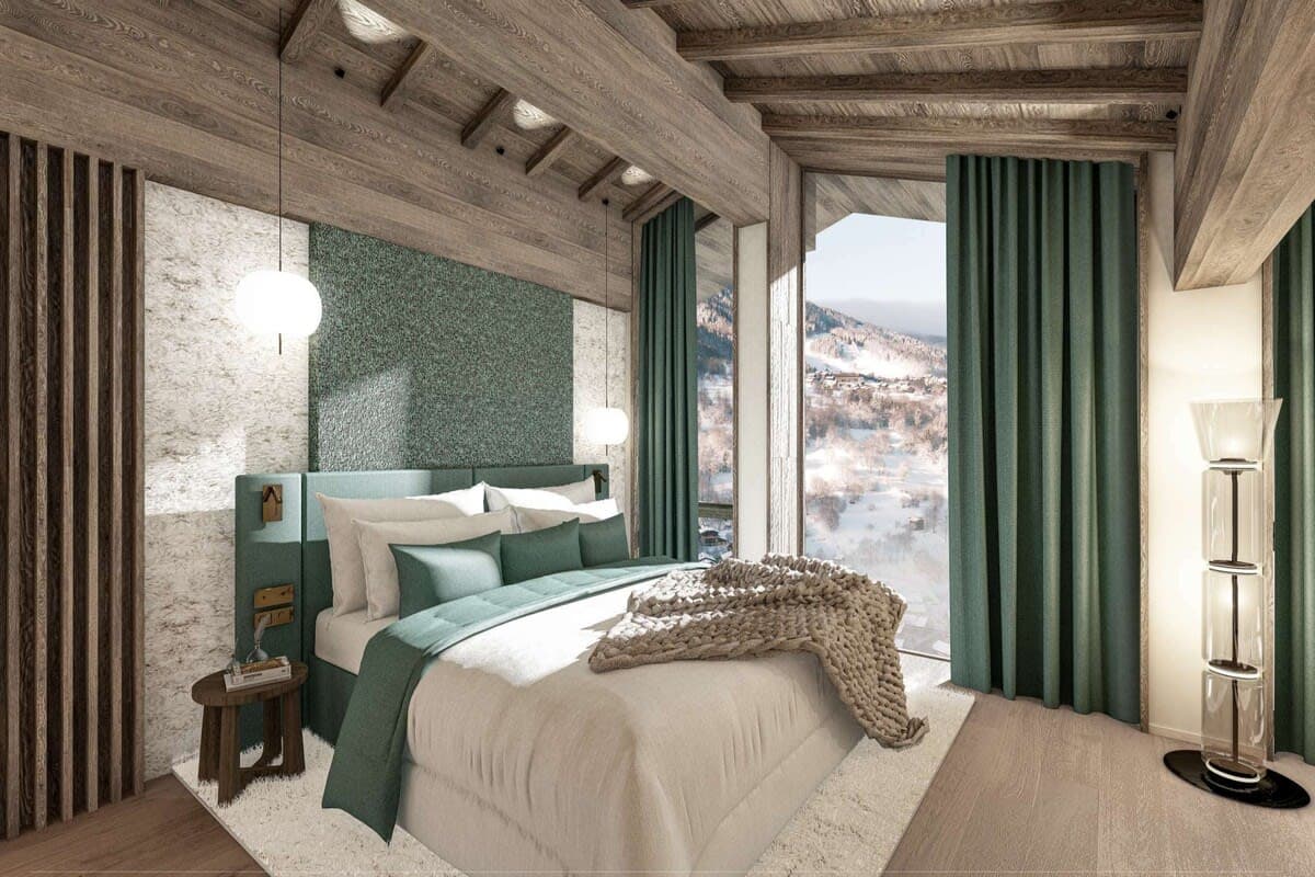Primary bedroom with king bed and floor-to-ceiling mountain views