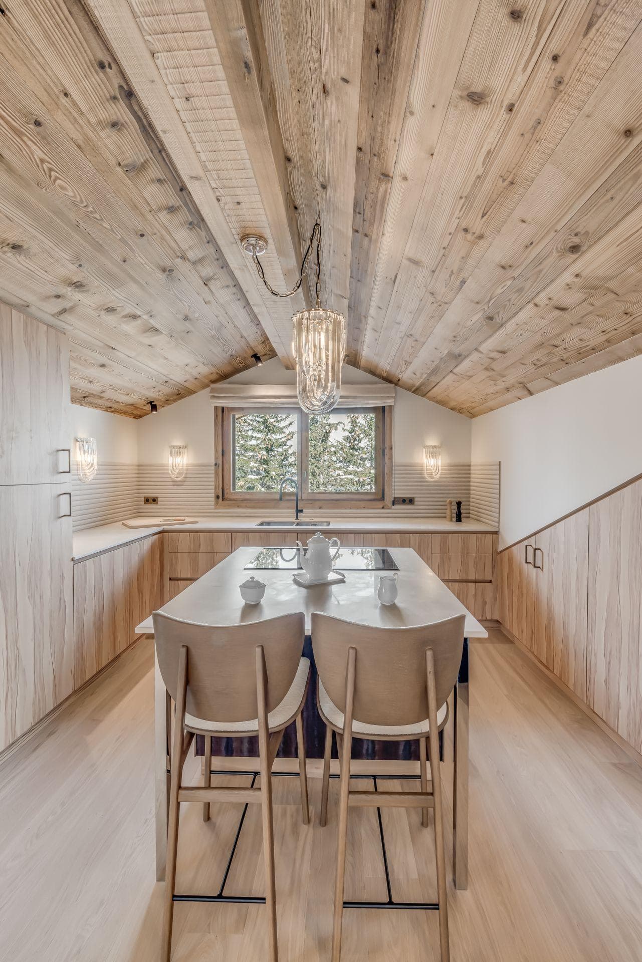 Kitchen with vaulted timber ceiling and island seating for two