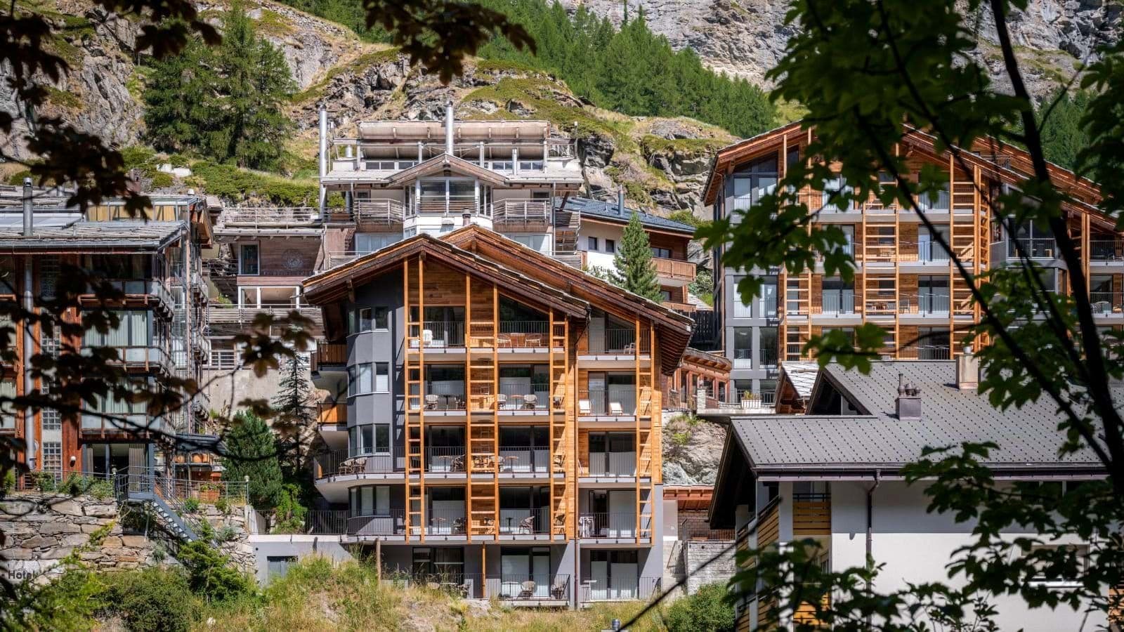 Chalet exterior featuring private balconies with south-facing mountain views