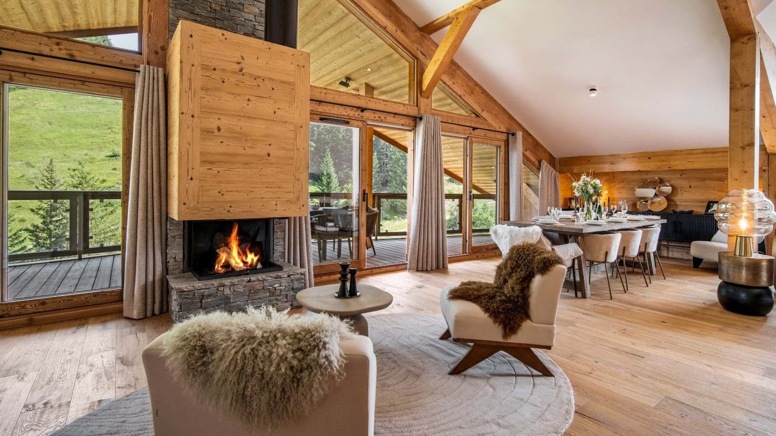 Open-plan living area with wood-burning fireplace and dining seating for 8