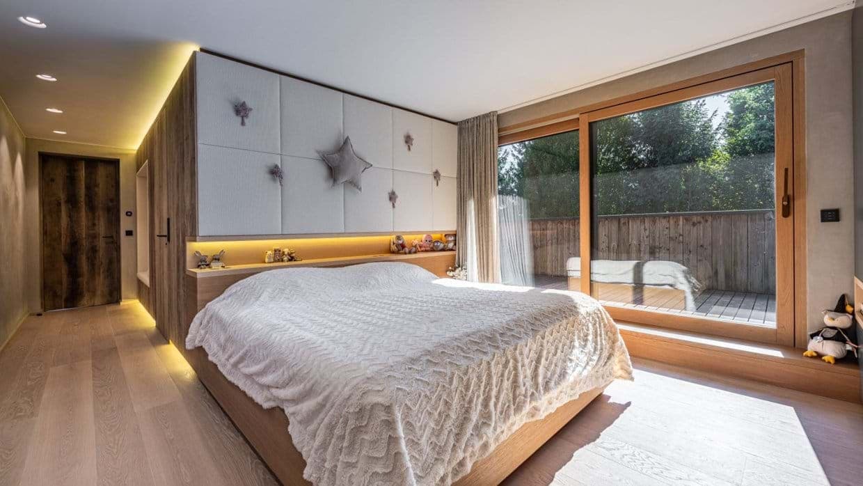 Bedroom with king bed and sliding glass doors to private terrace