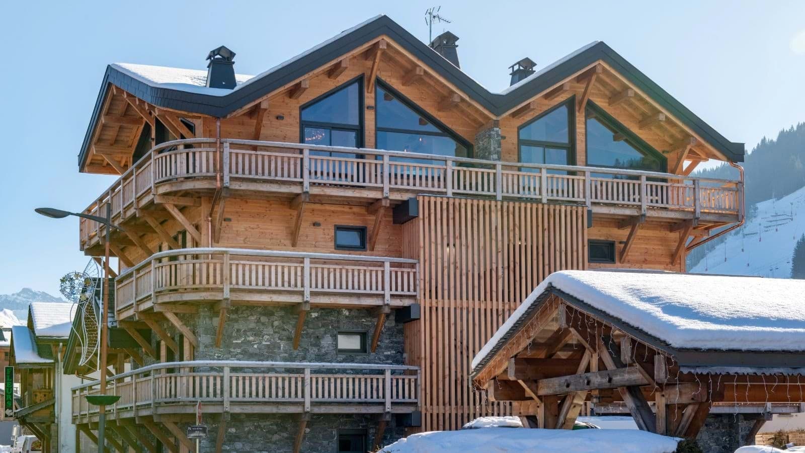 Ski-in, ski-out timber chalet with wrap-around balconies and mountain views