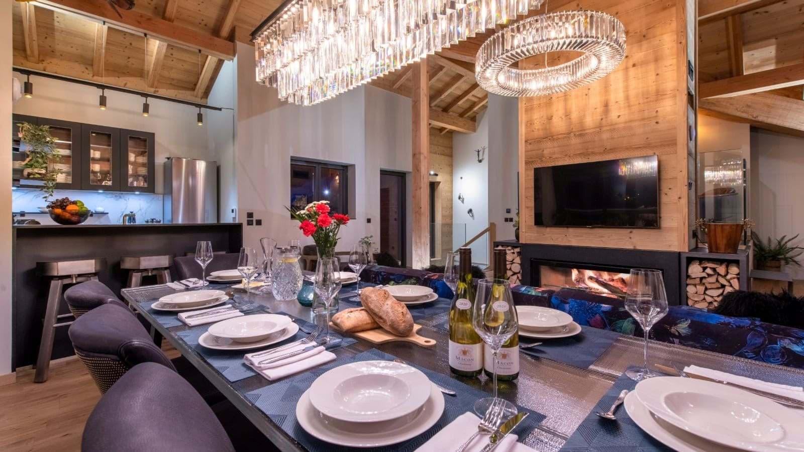 Open-plan dining area for 10 with wood-burning fireplace and breakfast bar