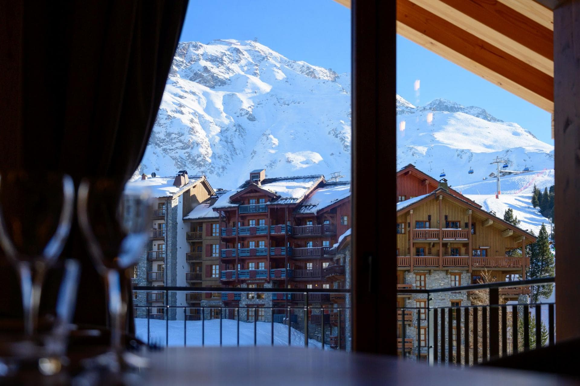 Dining area view of mountain peaks and nearby ski lifts