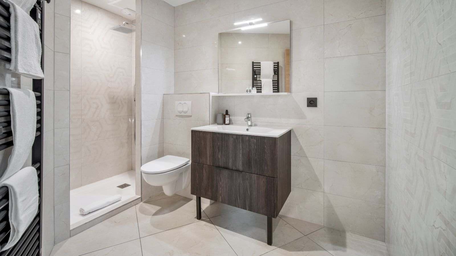 Bathroom with walk-in rainfall shower and heated towel rail