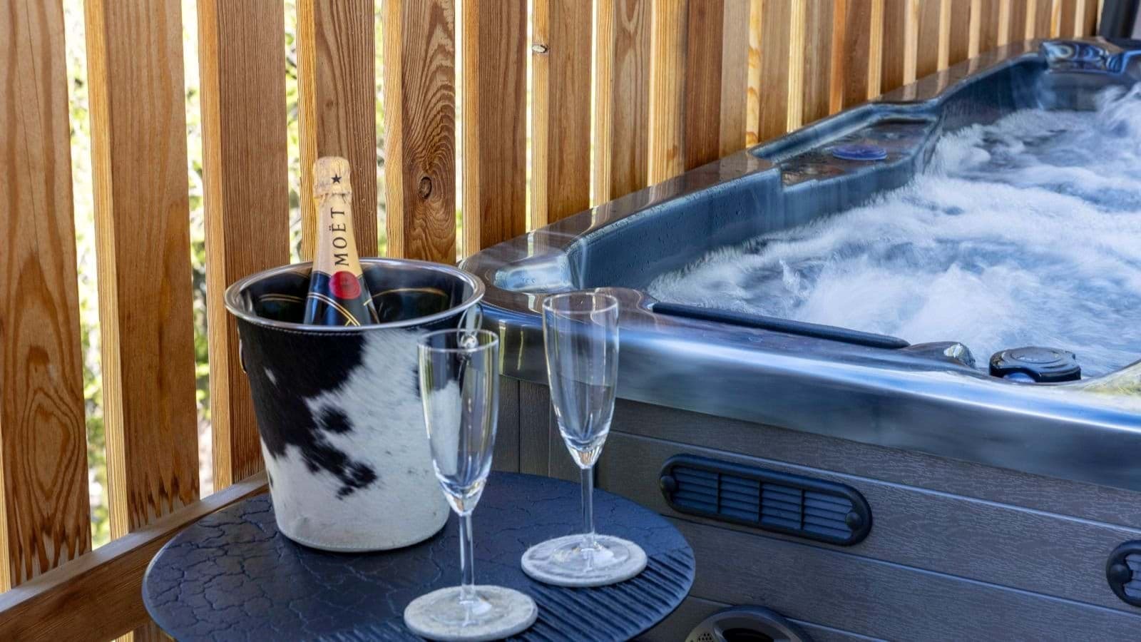 Private outdoor hot tub with wooden privacy screening