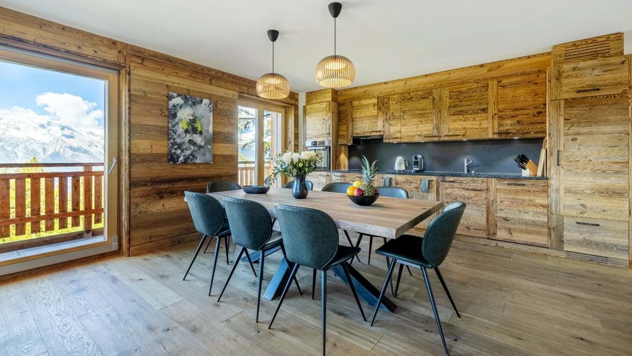 Dining table for 6 and kitchen with balcony mountain views