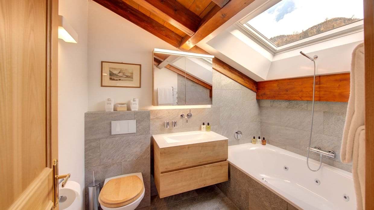 Bathroom with jetted soaking tub and operable skylight