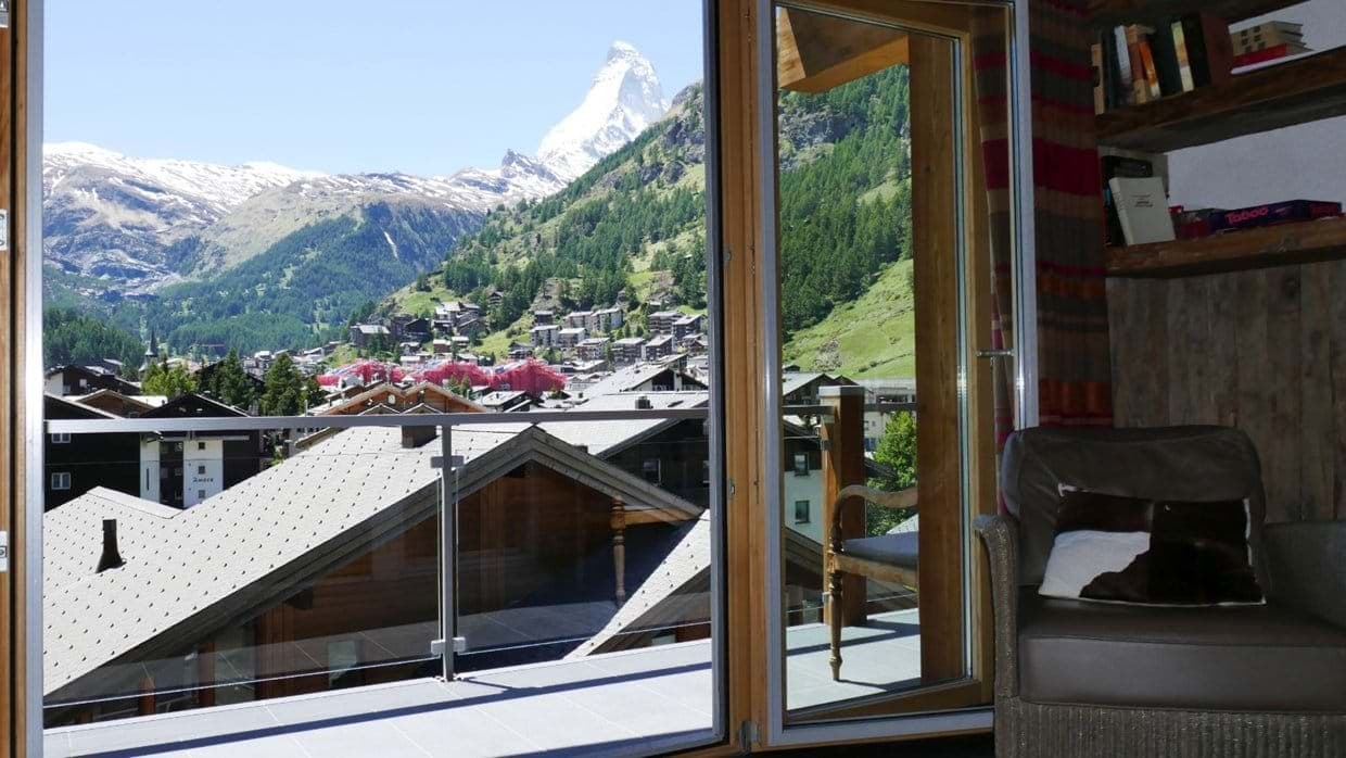 Private balcony with glass railing and direct Matterhorn views