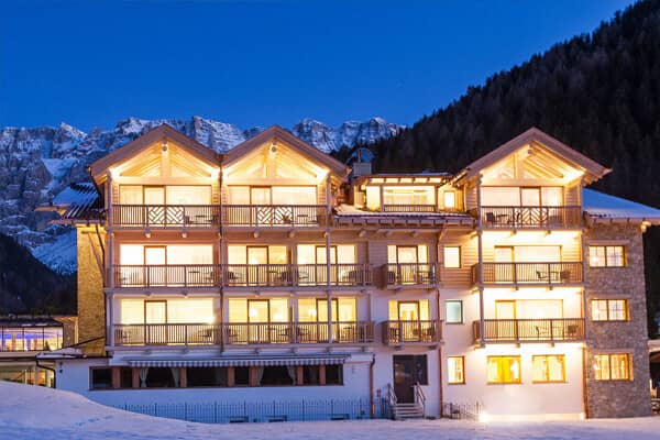Ski-in/ski-out lodge exterior with private balconies and mountain views