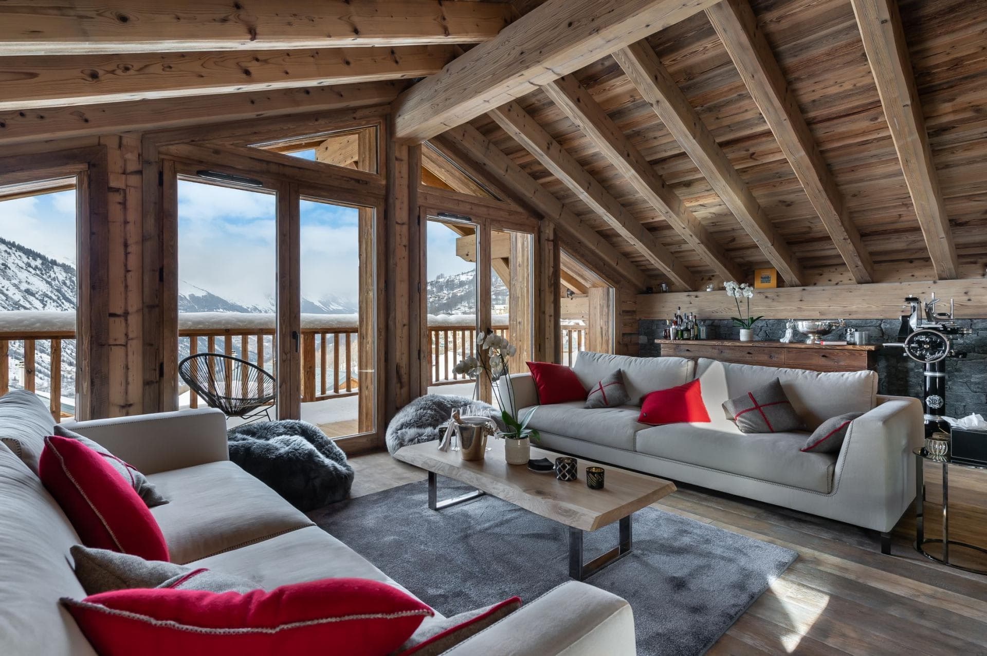 Top floor living area with vaulted timber ceilings and mountain views