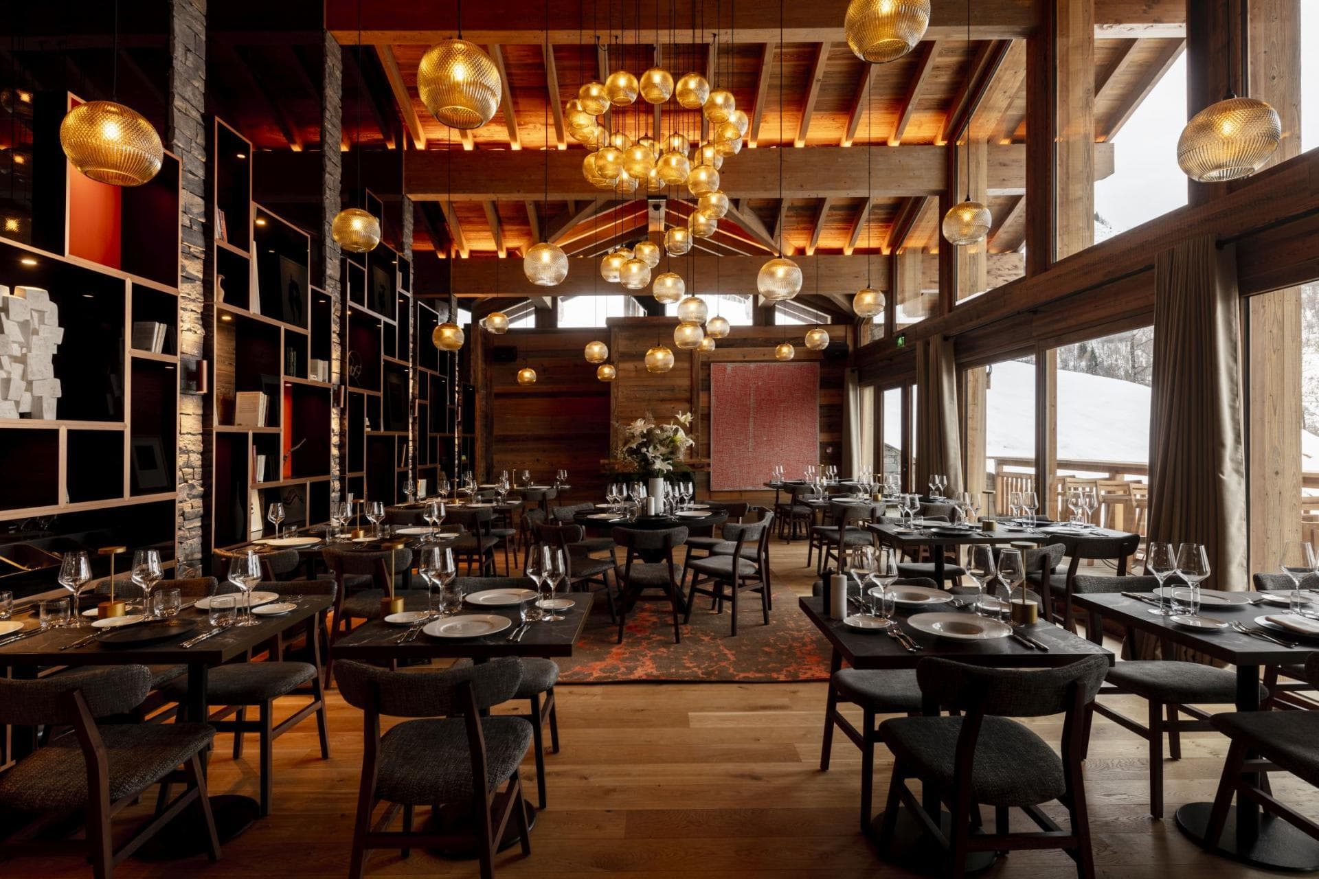 Dining room with vaulted wood ceilings and ski-in/ski-out terrace access