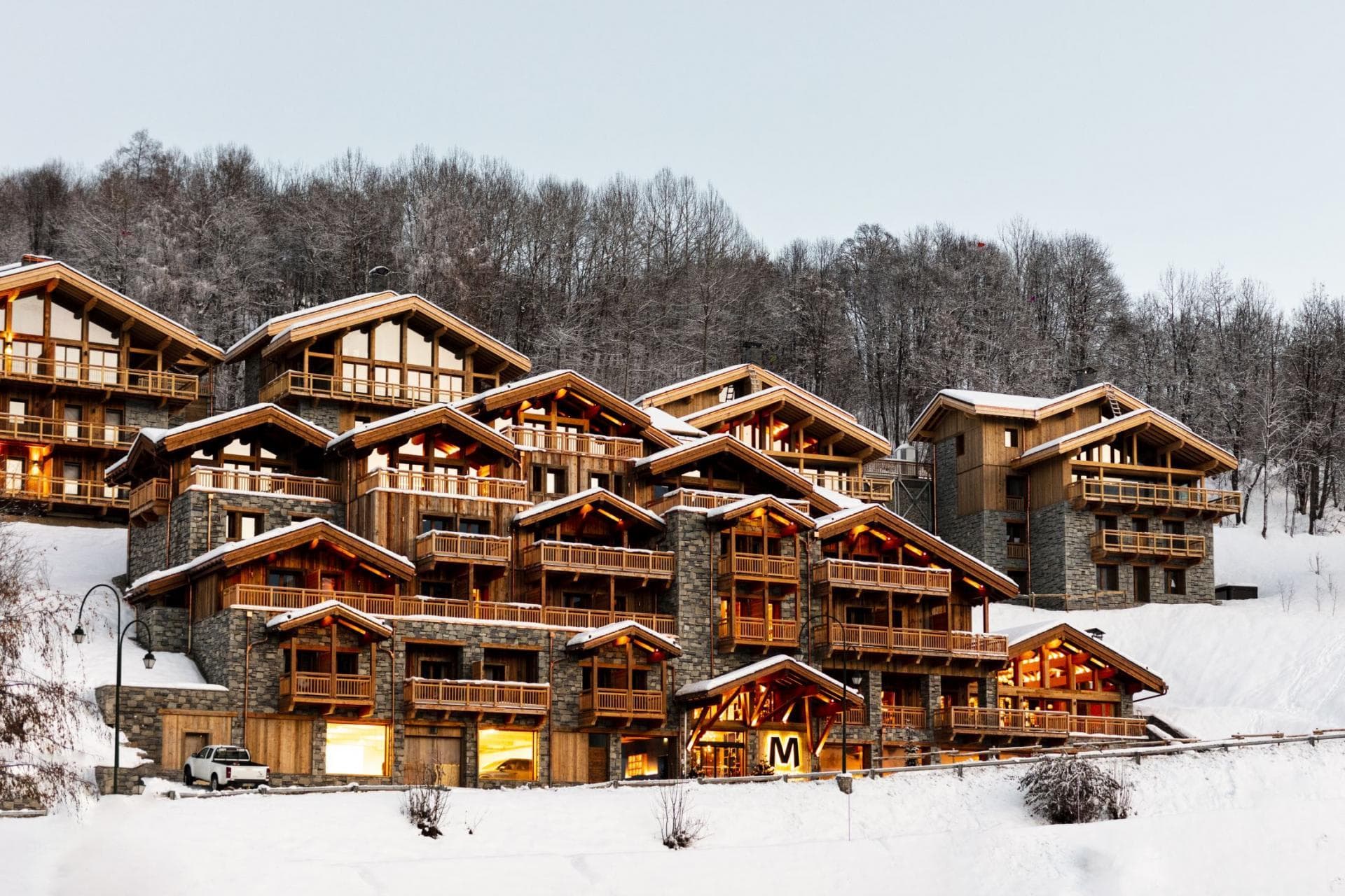 Ski-in, ski-out timber chalets with private balconies and heated underground parking