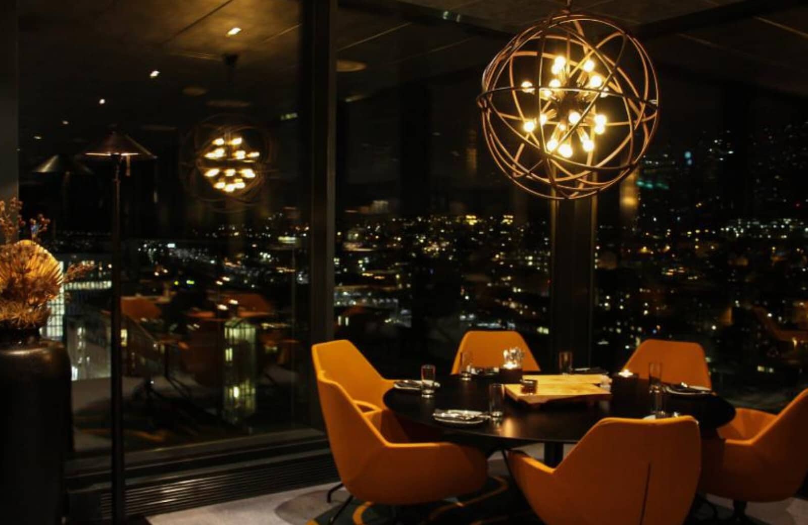 Dining area with city skyline views and seating for 4