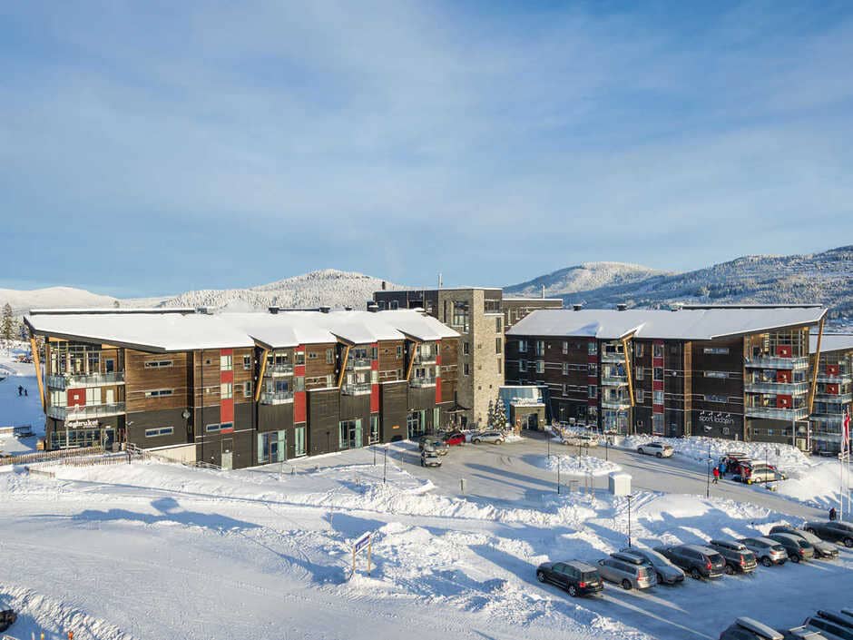Ski-in, ski-out lodge exterior with mountain views and onsite parking