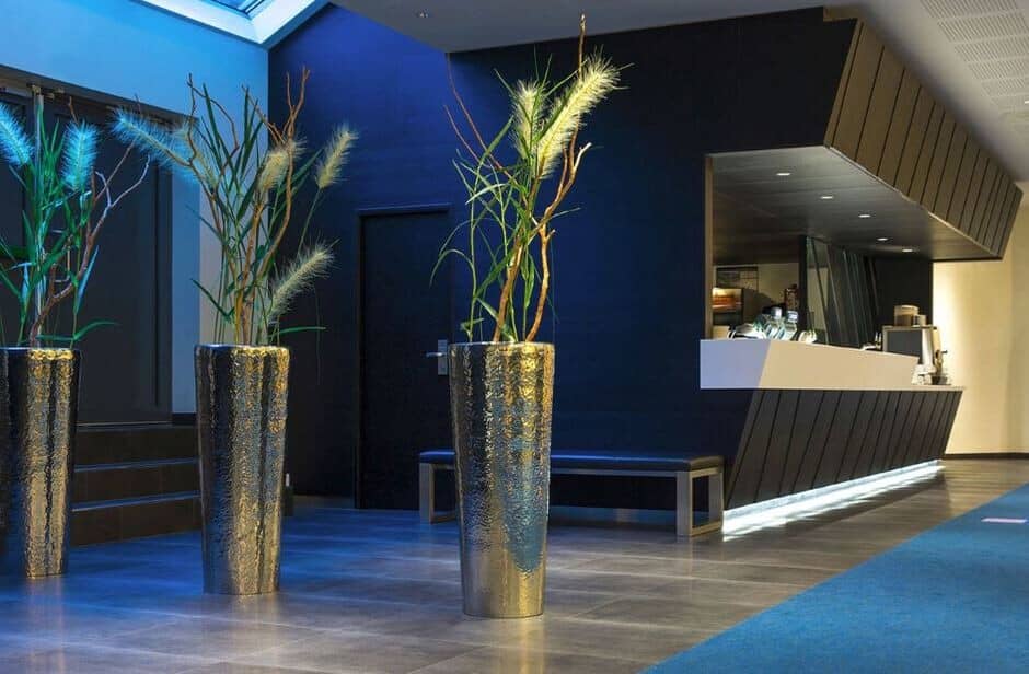 Building lobby with concierge desk, skylight, and seating area