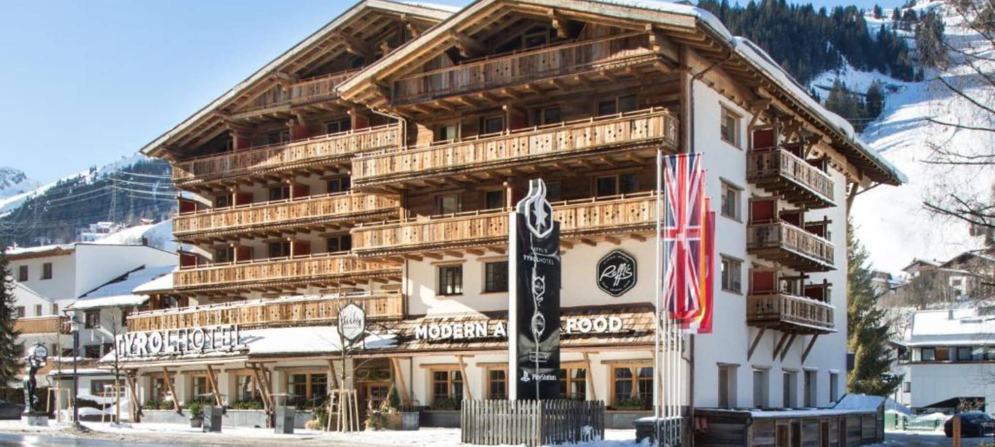 Chalet exterior with private wooden balconies and on-site restaurant