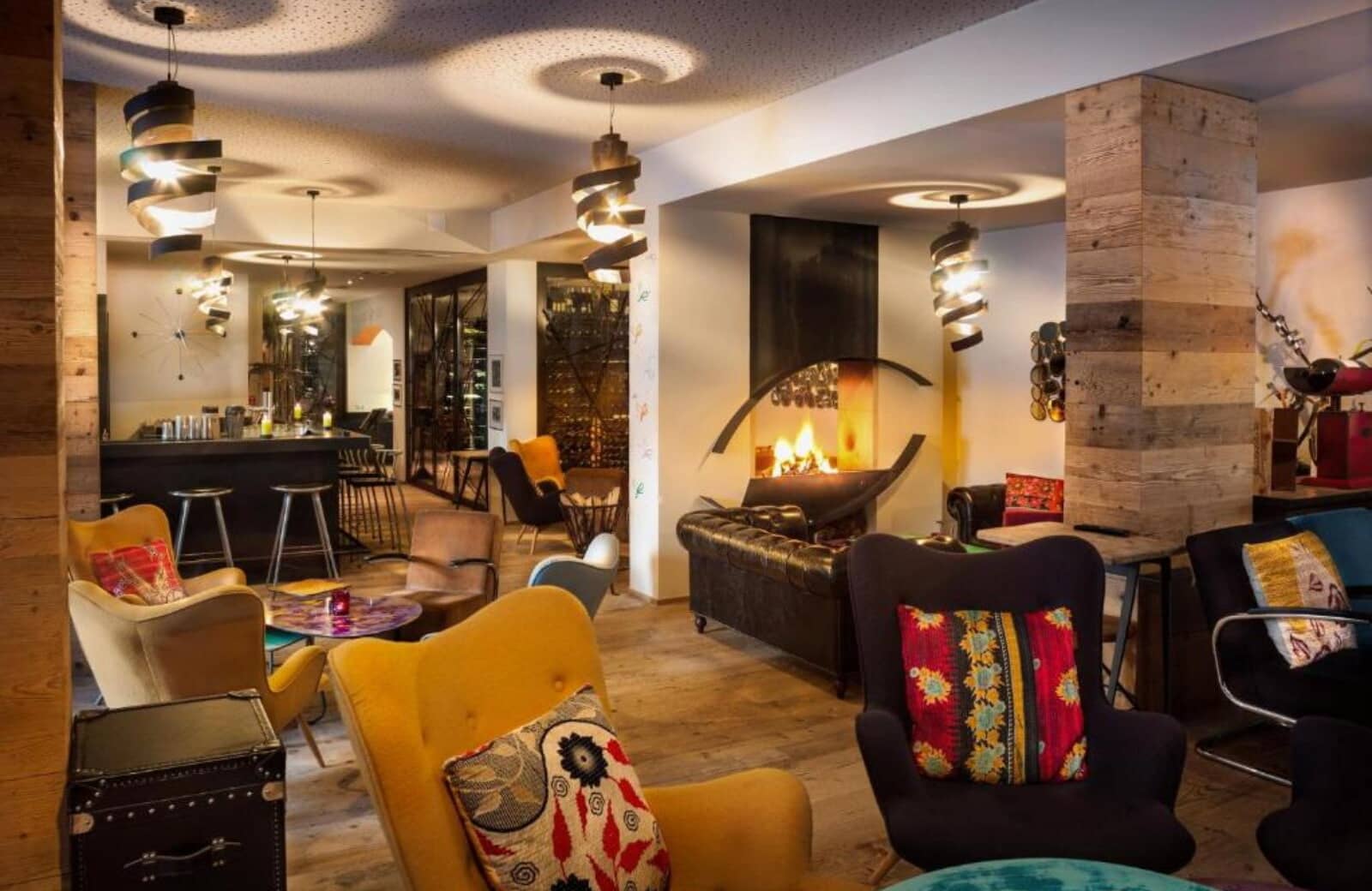 Lounge area with wood-burning fireplace, wet bar, and wine storage