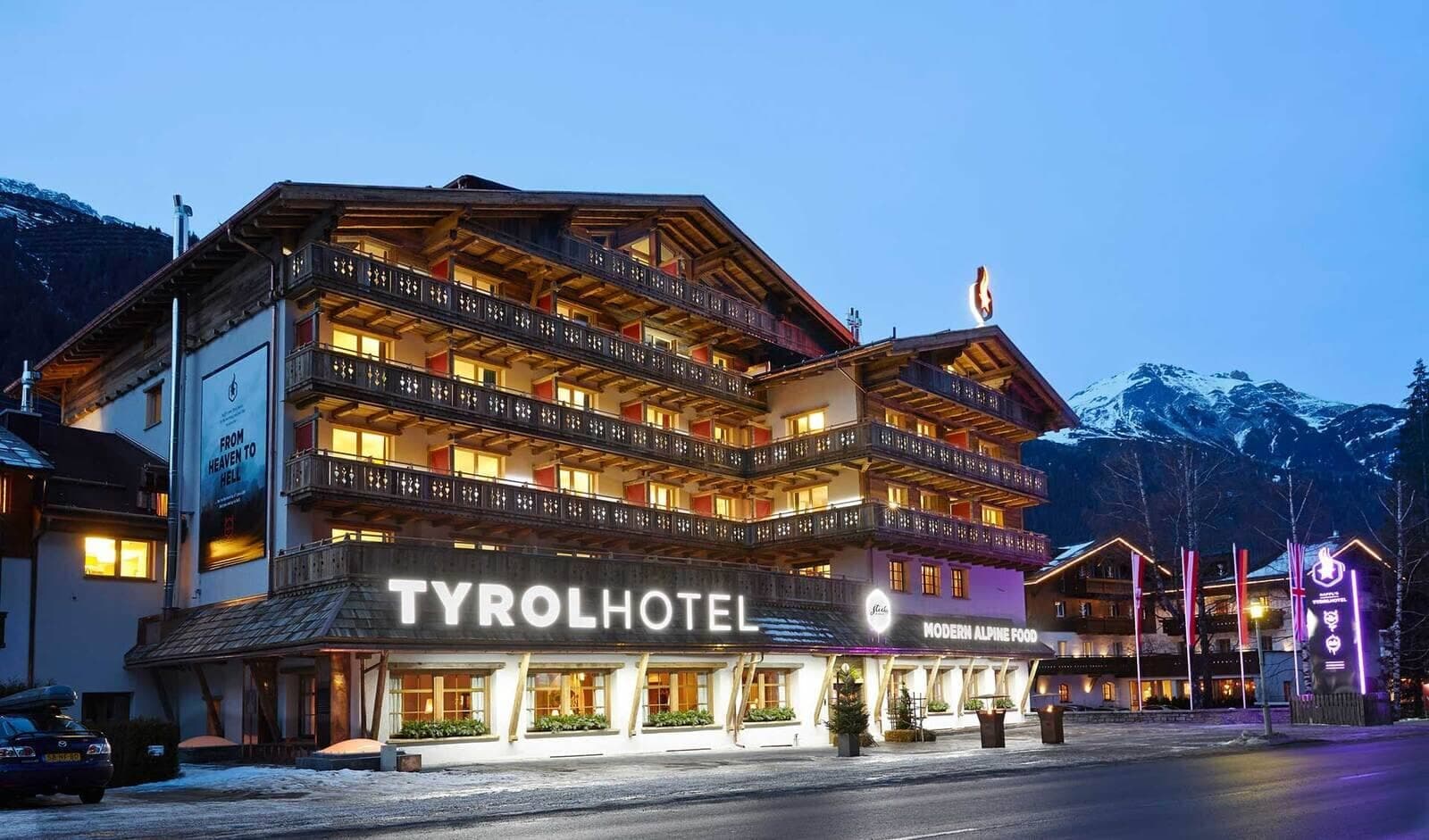 Tyrol Hotel exterior with wrap-around balconies and on-site restaurant
