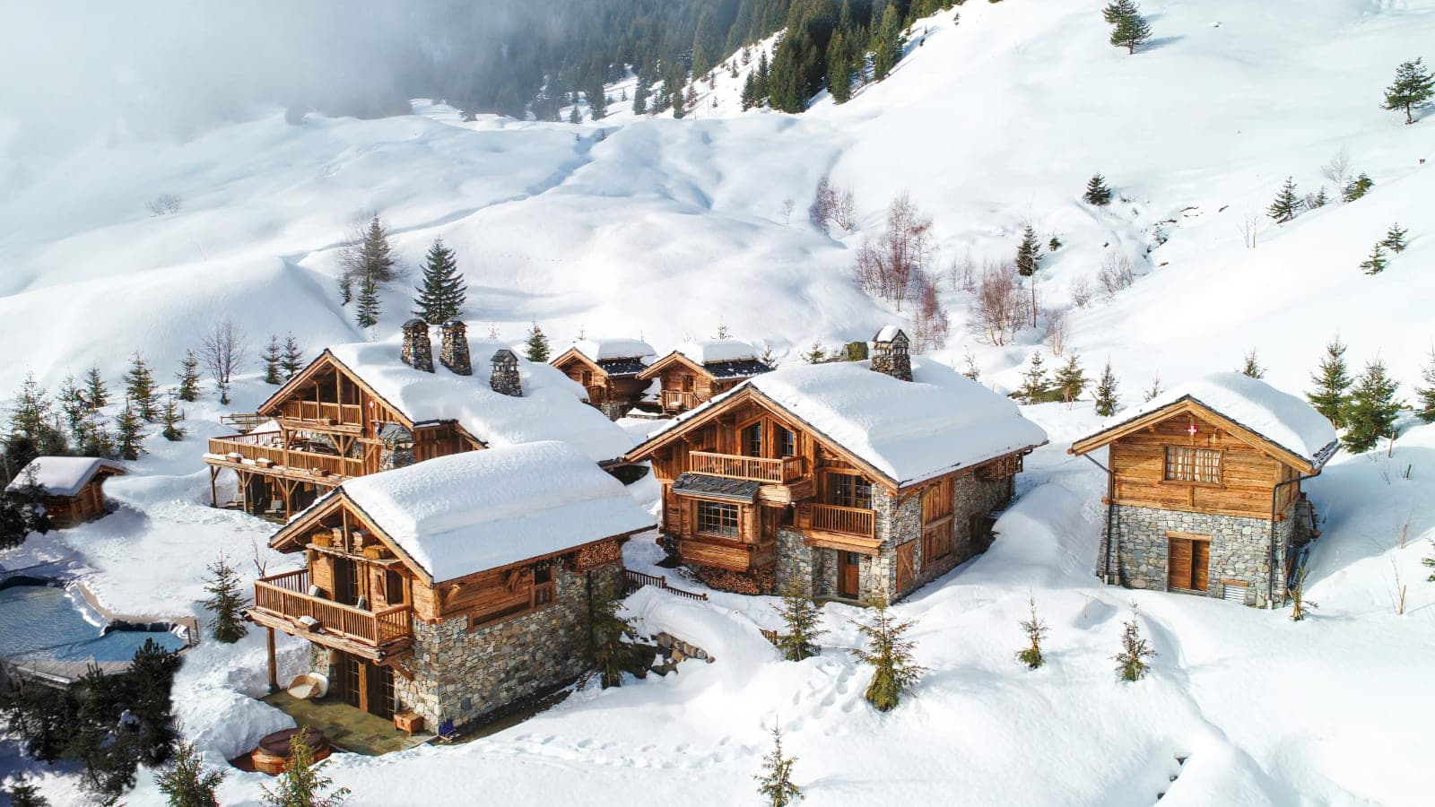 Ski-in, ski-out timber chalets with private outdoor pool and mountain views