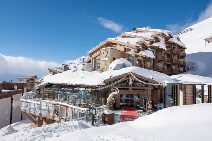 Ski-in/ski-out chalet building with sun terrace and geodesic domes