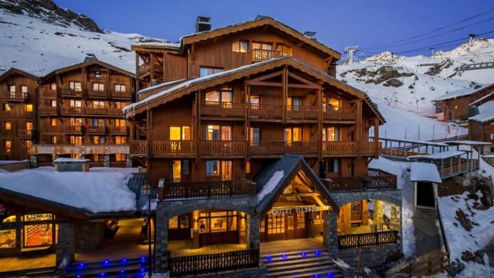 Chalet exterior with ski-in/ski-out access and nearby mountain lifts