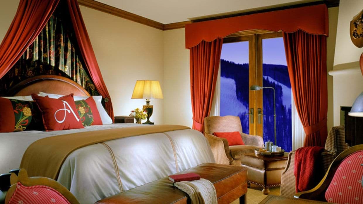 Primary bedroom with king bed and ski-in/ski-out mountain views