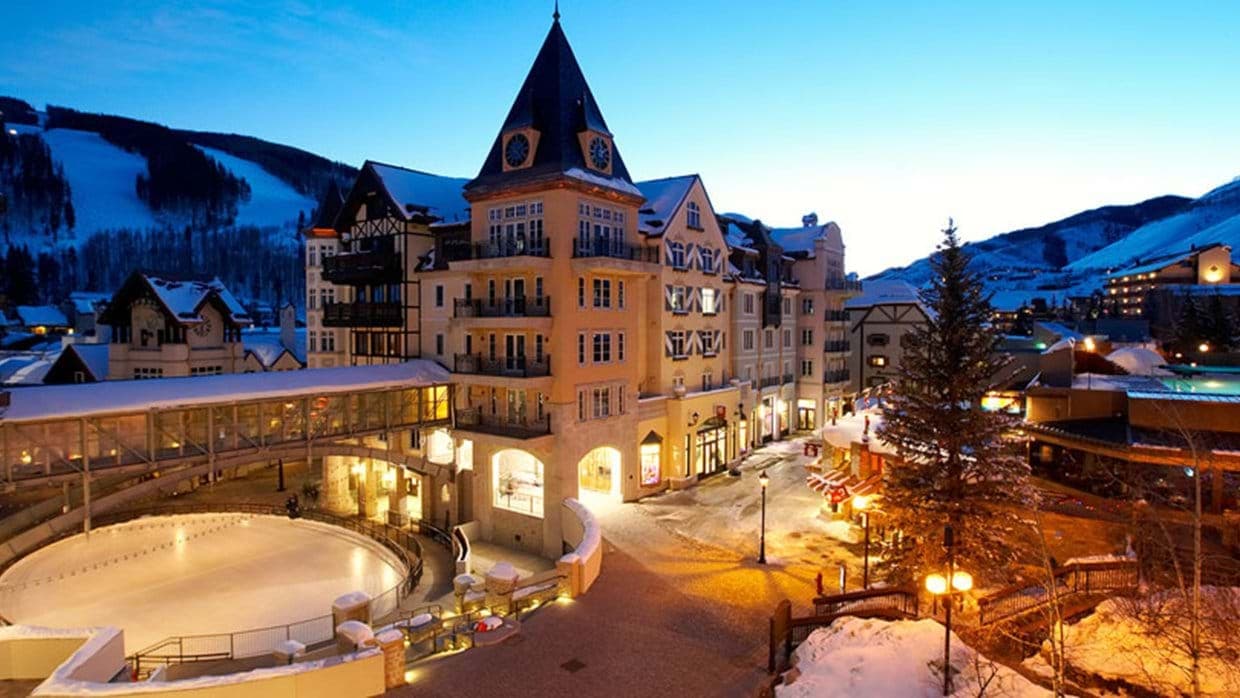 Ski-in/ski-out village exterior with skating rink and mountain views