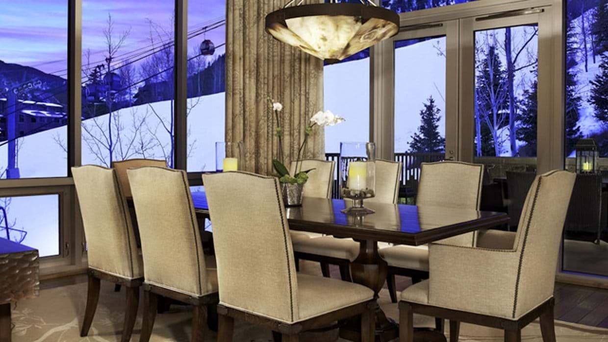 Dining area seats 8; floor-to-ceiling windows with gondola views