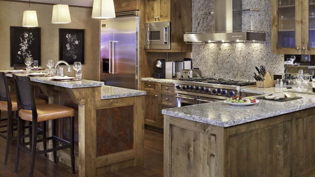 Kitchen with Wolf gas range and breakfast bar seating