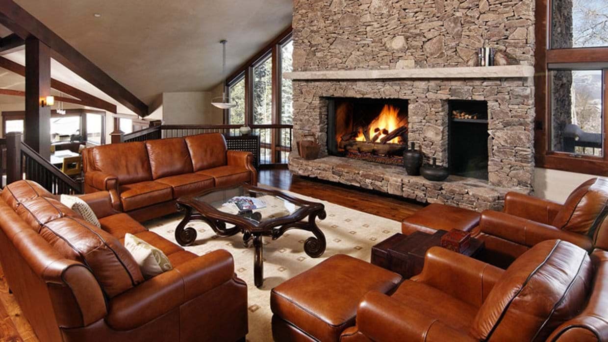 Living room with wood-burning fireplace and seating for 8
