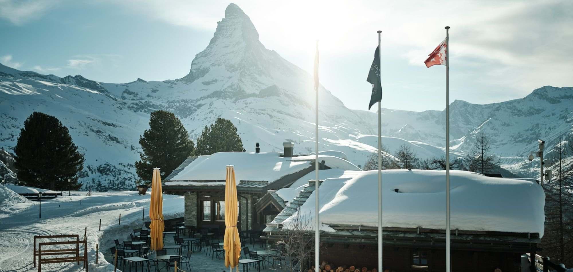 Stone patio seating with Matterhorn views and ski-in/ski-out access