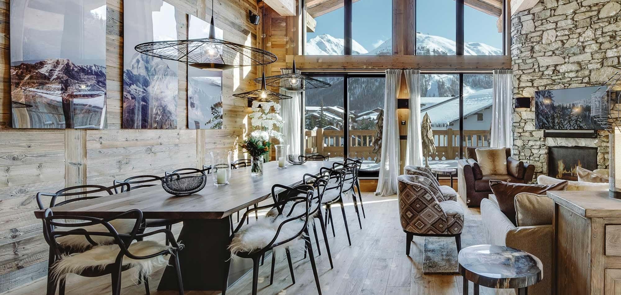 Open-plan dining area seating 12; floor-to-ceiling mountain views