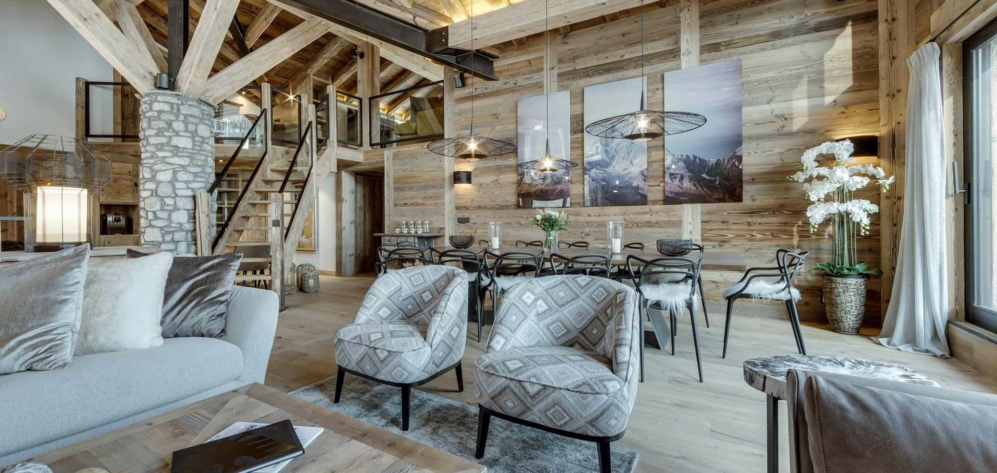 Open-plan living area with dining table for 8 and mezzanine access