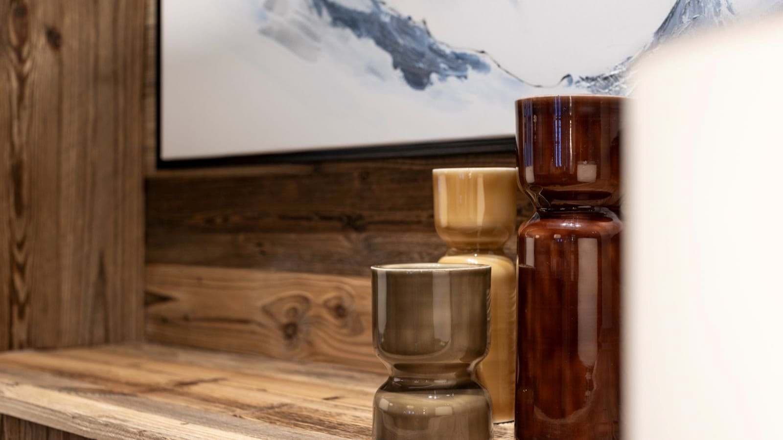 Decorative ceramic vases on reclaimed wood shelving