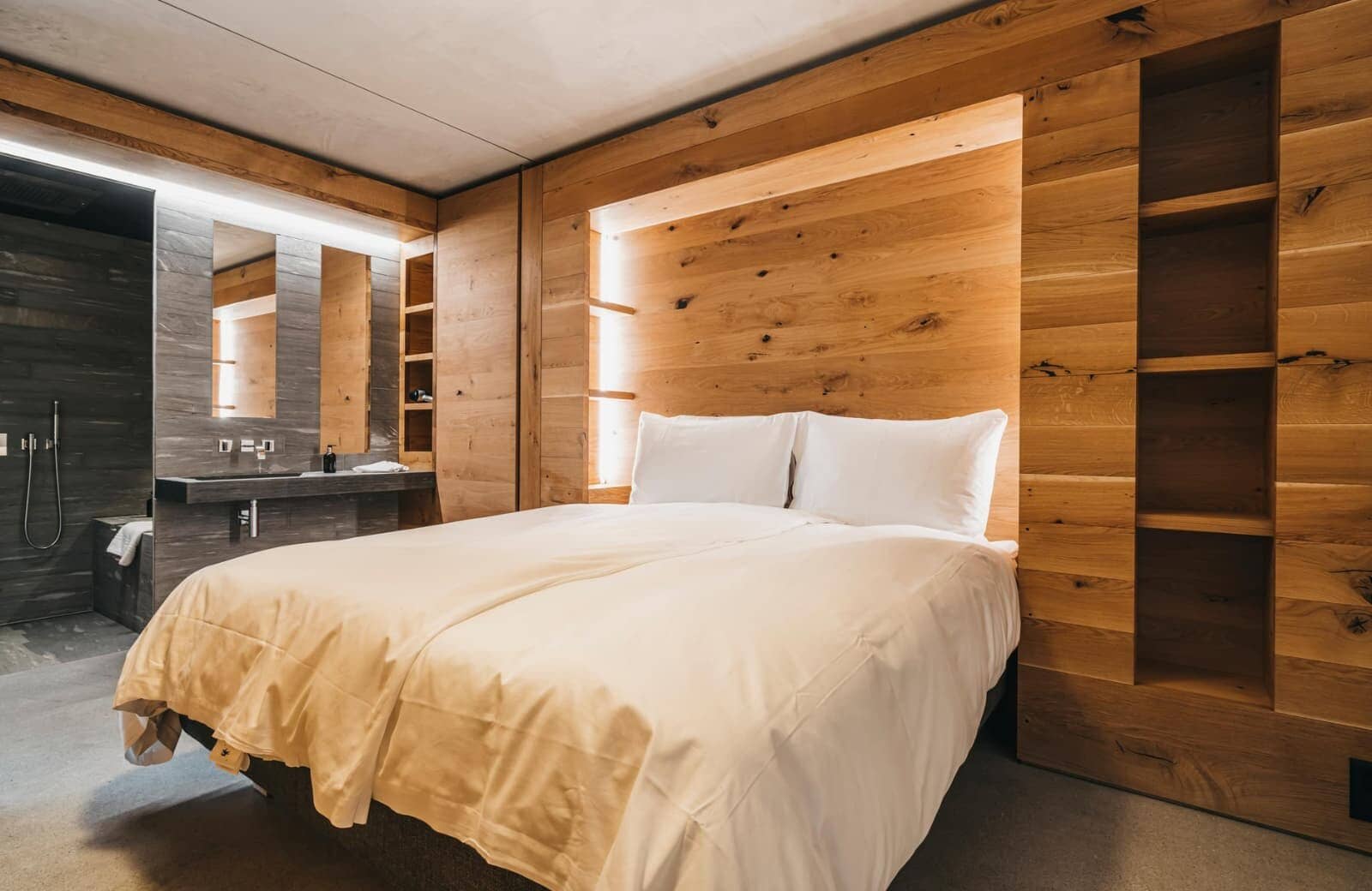 Primary bedroom with king bed and open-concept en-suite bathroom