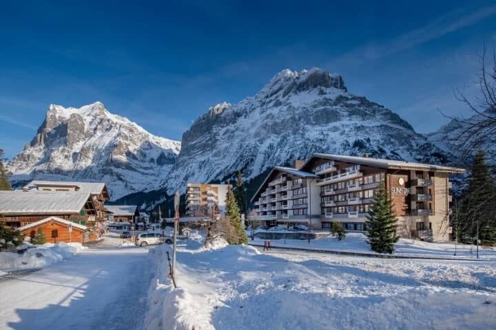 Hotel exterior with private balconies and Wetterhorn mountain views