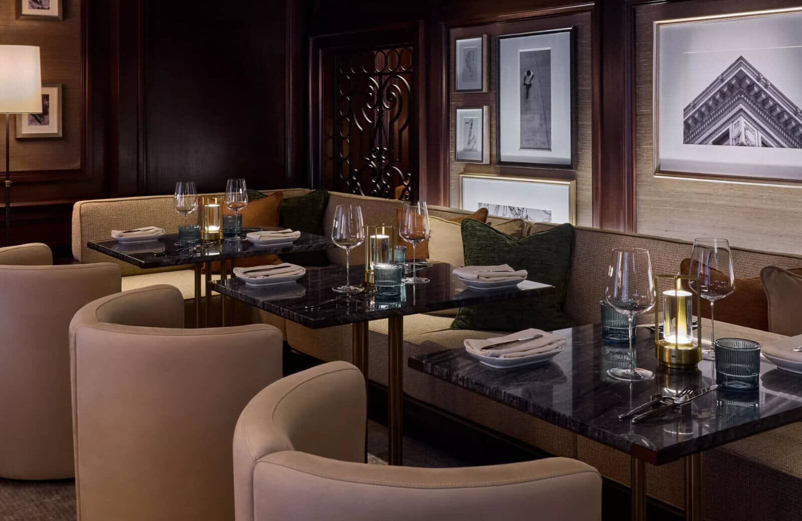 Dining area with marble-top tables and built-in banquette seating