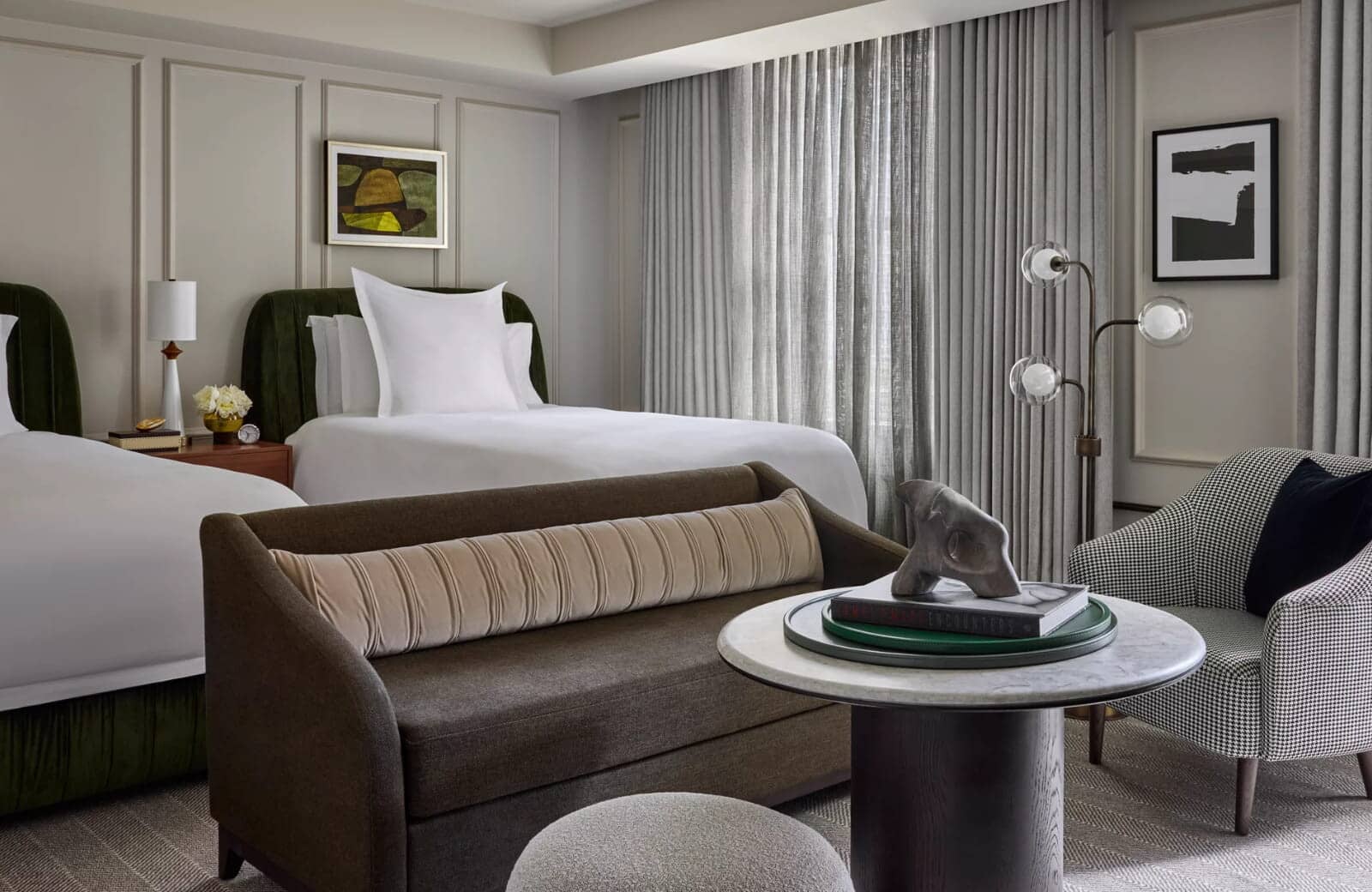 Bedroom with two queen beds and integrated lounge seating area