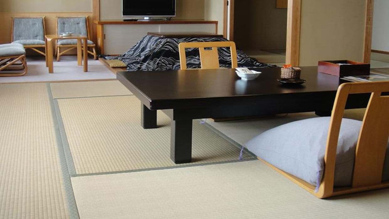 Living area with tatami mats, floor seating, and heated kotatsu table