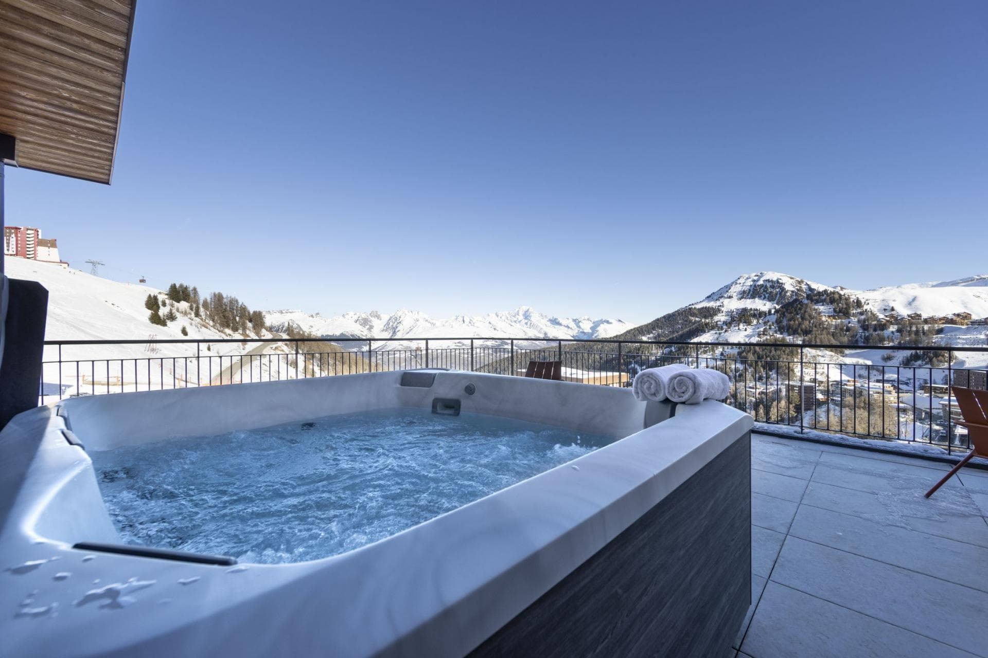Private balcony hot tub with panoramic Alpine views