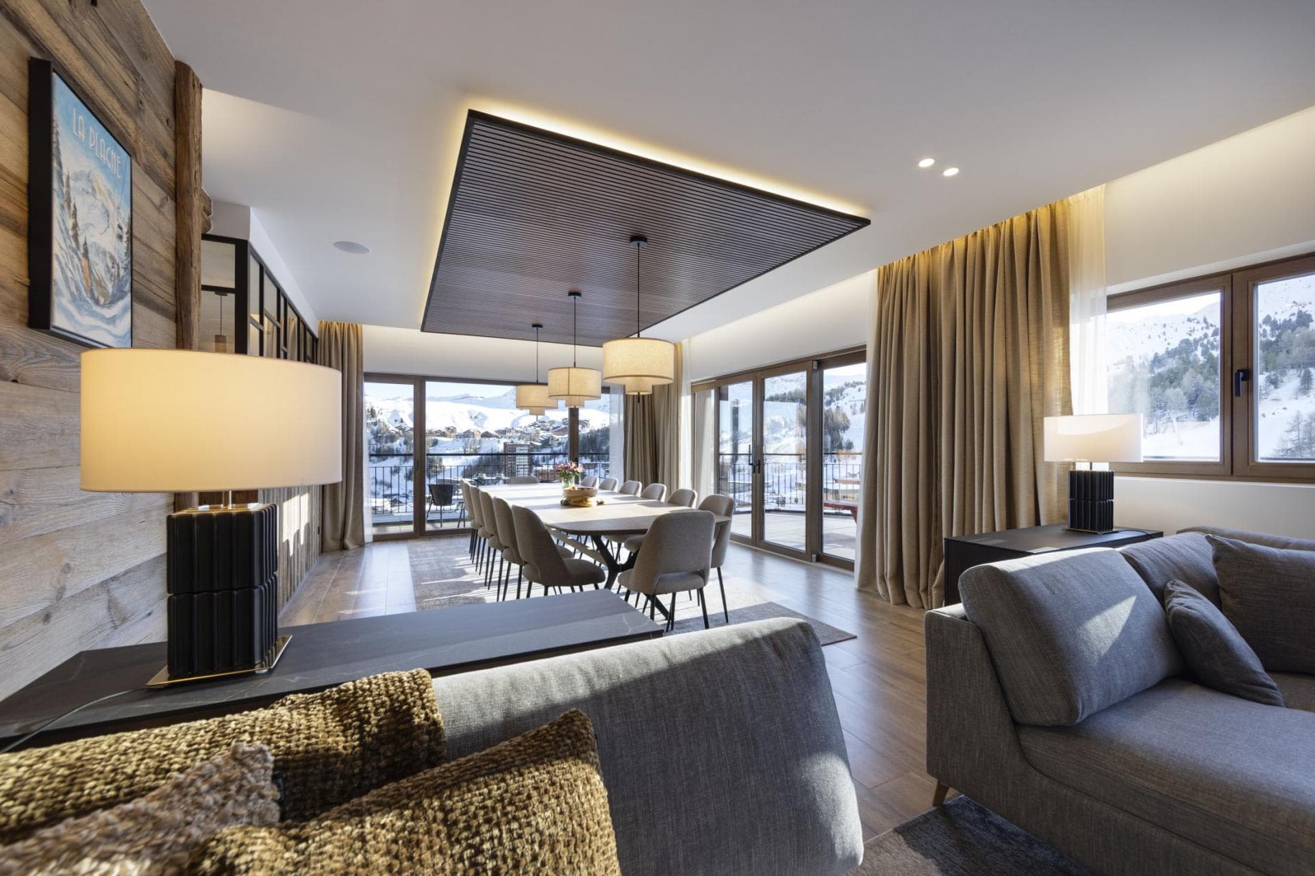 Open-plan dining area seats 12 with panoramic mountain and balcony views