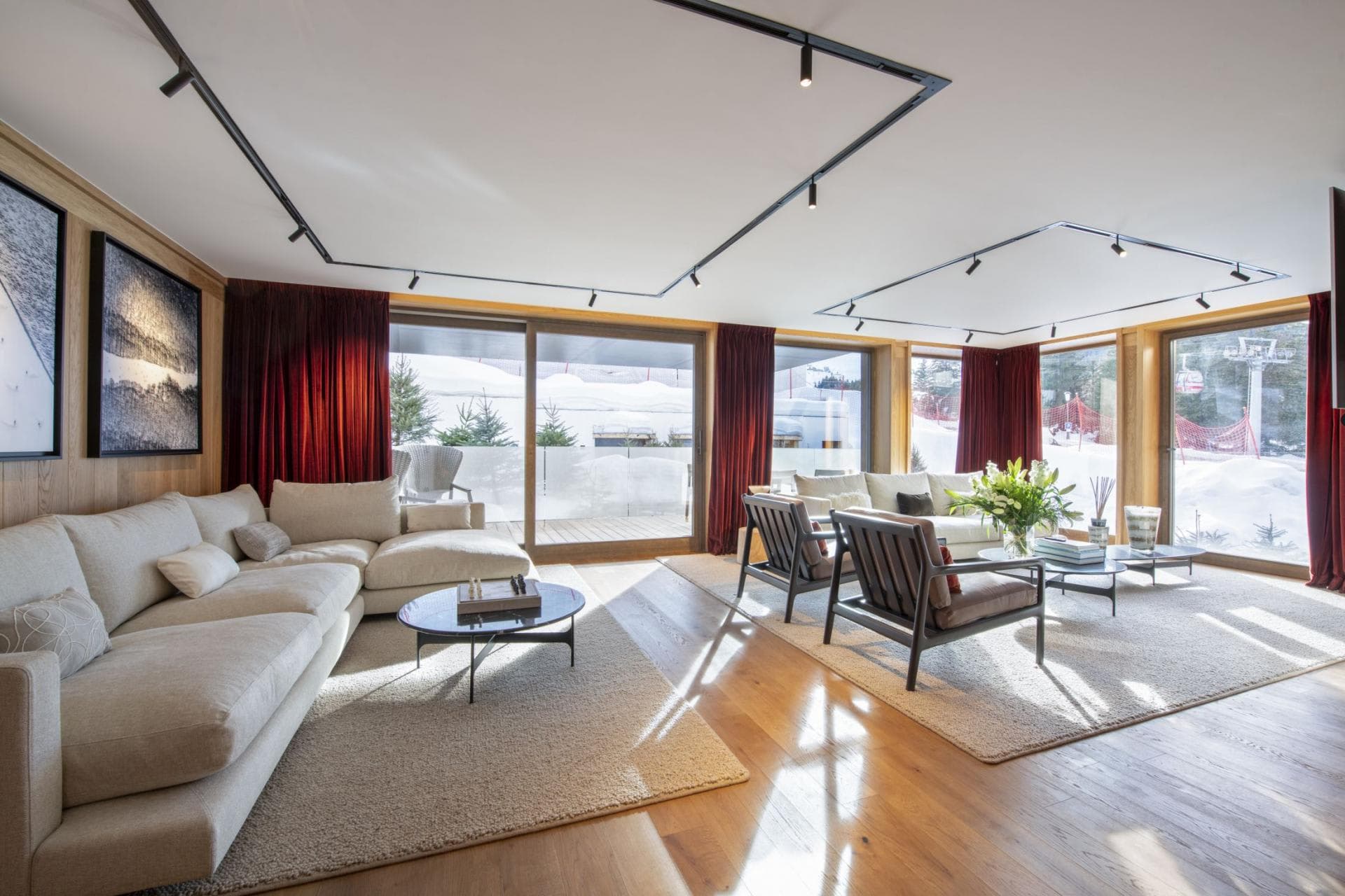 Living area with track lighting and ski-in/ski-out terrace access