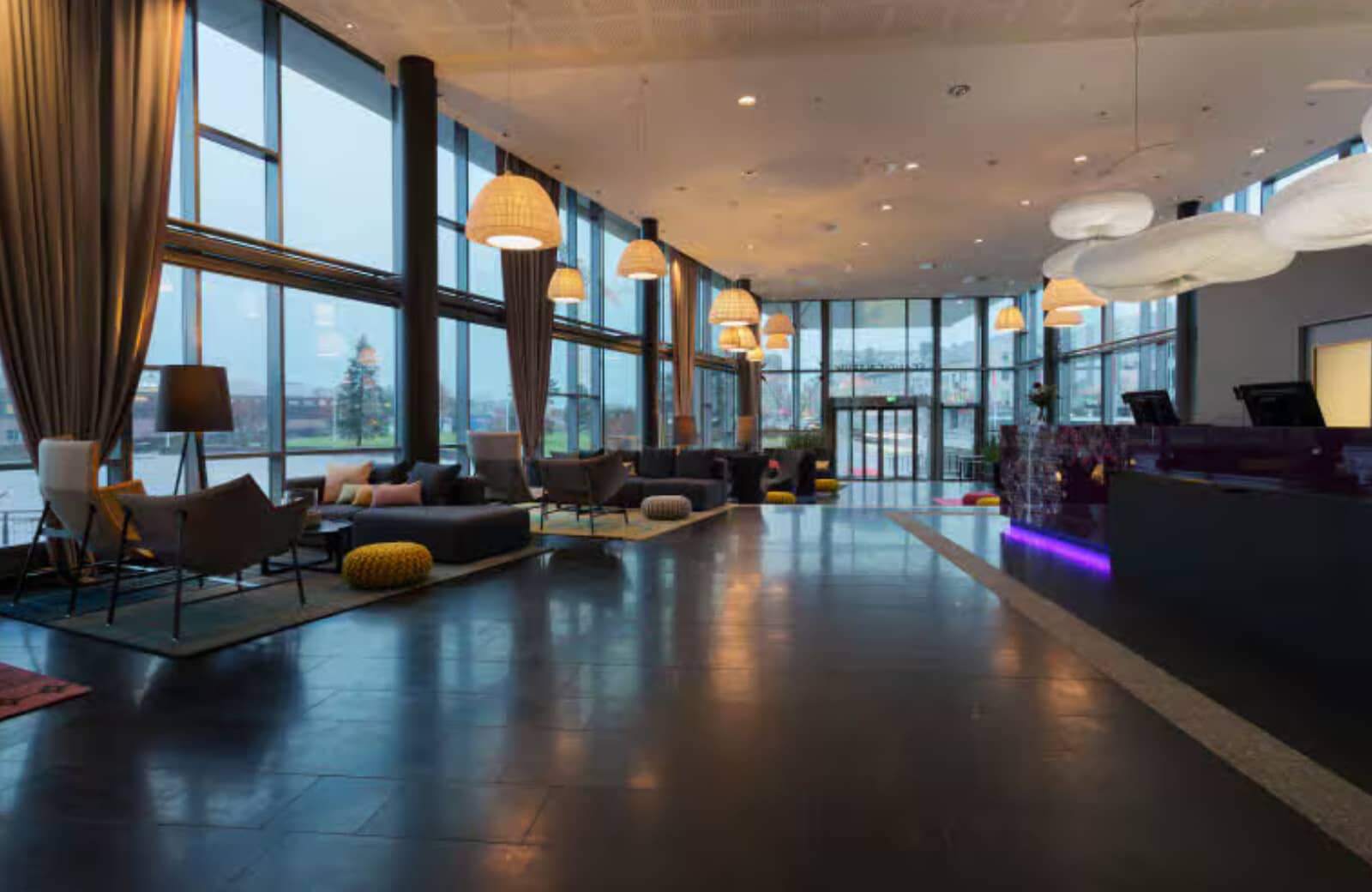 Lobby and reception area with floor-to-ceiling windows and lounge seating