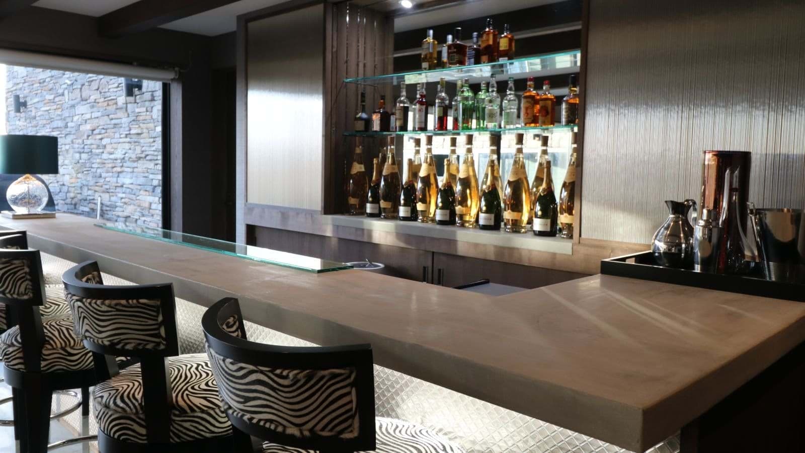 Private bar with backlit counter and zebra print seating