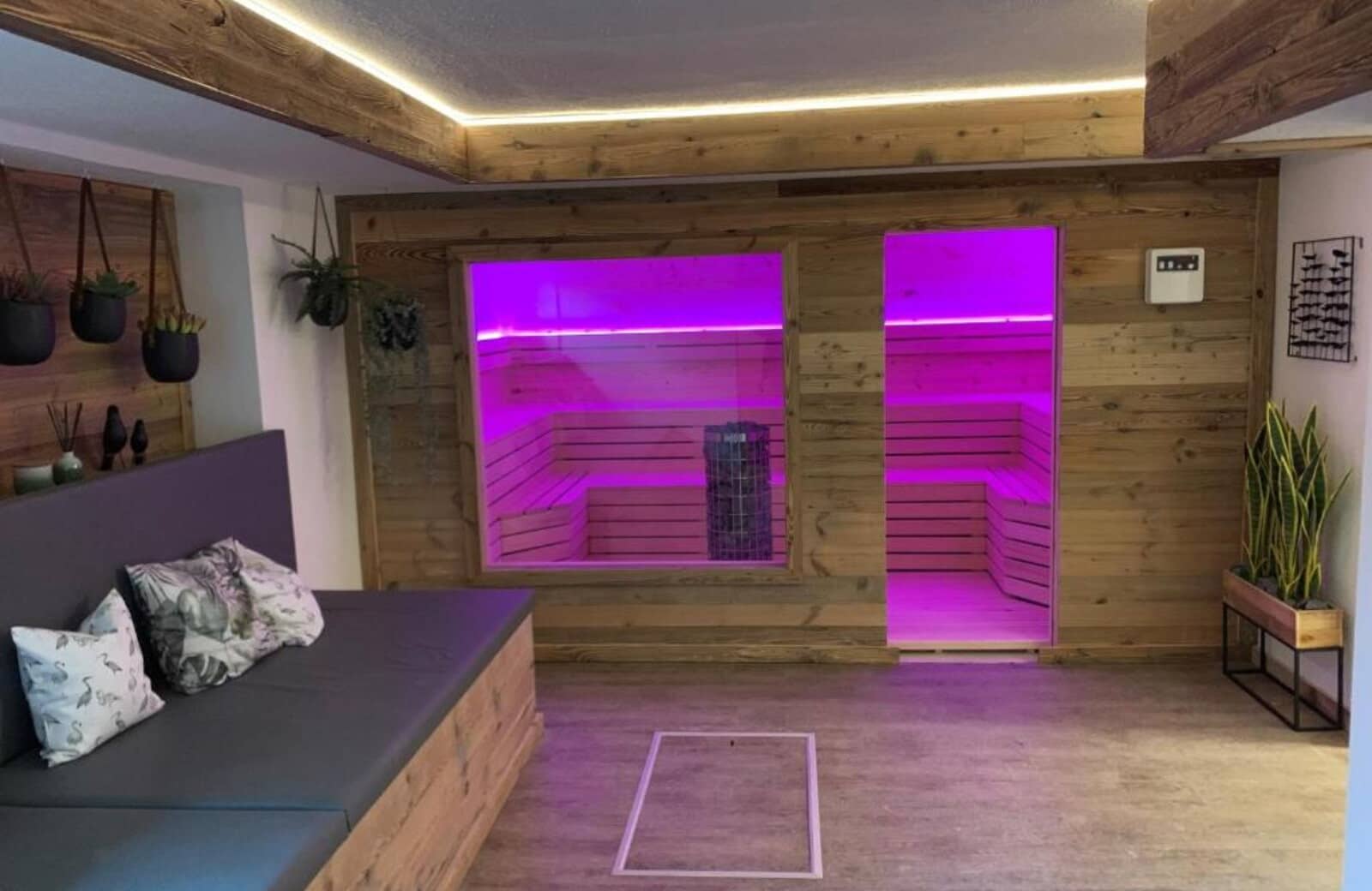 Private sauna with LED mood lighting and adjacent lounge seating