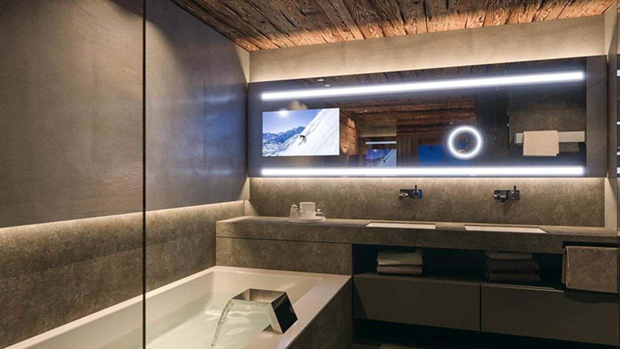 Bathroom with dual vanity and integrated mirror television