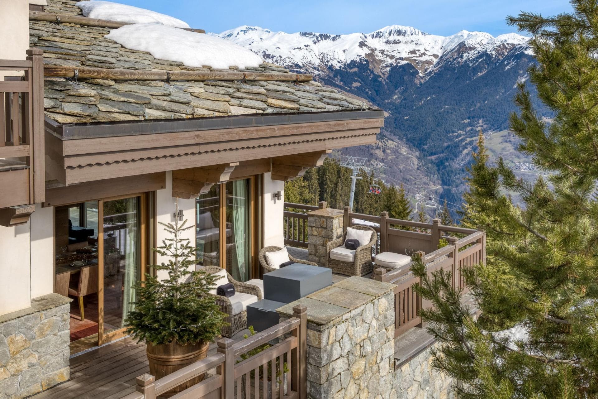 Private balcony with gas fire pit and Alpine valley views