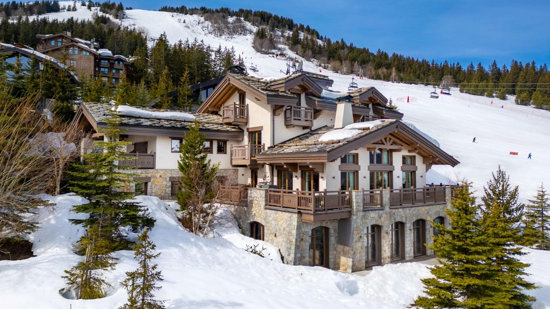 Ski-in/ski-out chalet exterior located directly on the mountain slope