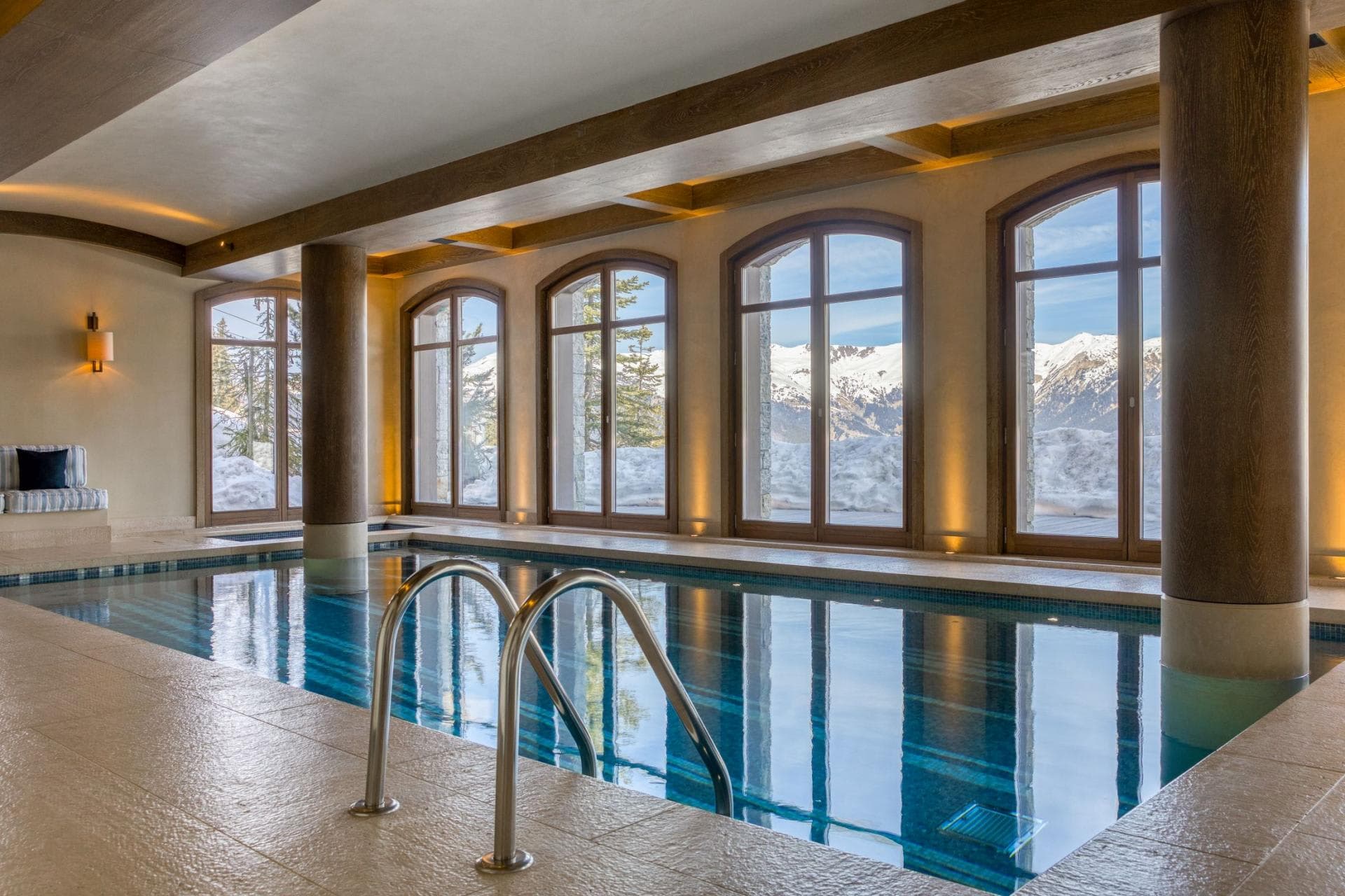 Indoor pool with mountain views and adjacent hot tub